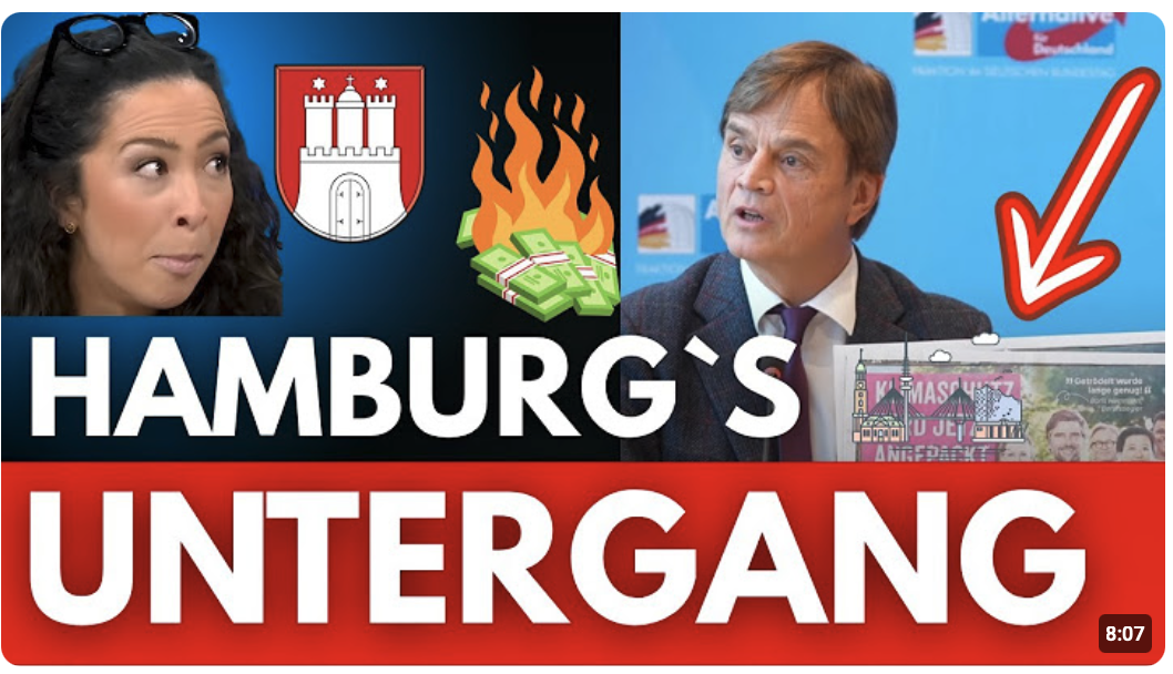 Bürger jubeln, während Bernd Baumann plötzlich dieses Plakat zeigt